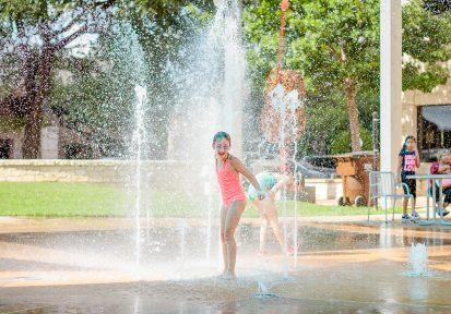 kids at outdoor splash pad